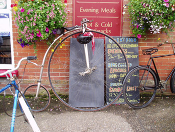 An ordinary with cycle helmet hanging on the handlebars